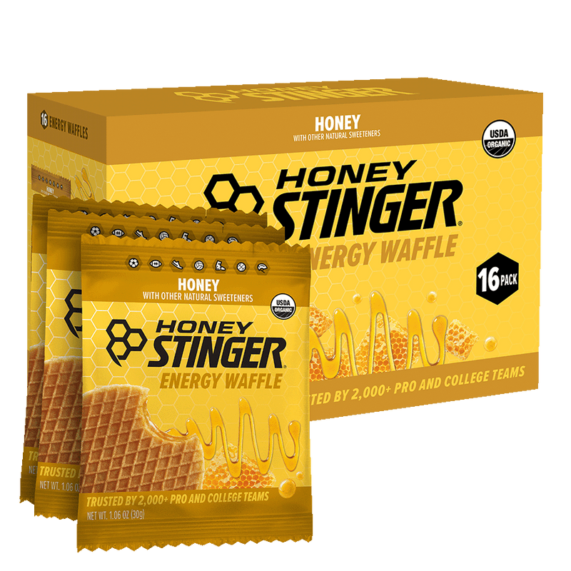 Honey Stinger Energy Waffle packaging with a box and multiple packets on a white background