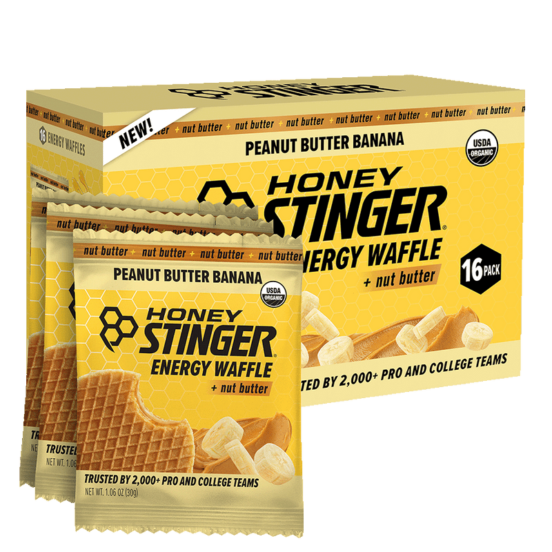 Honey Stinger Peanut Butter Banana Energy Waffle packaging with a box of 16 packs.