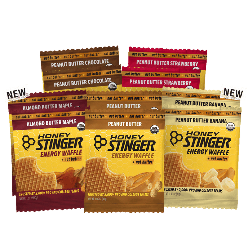 Honey Stinger energy waffle packages in various flavors on a white background