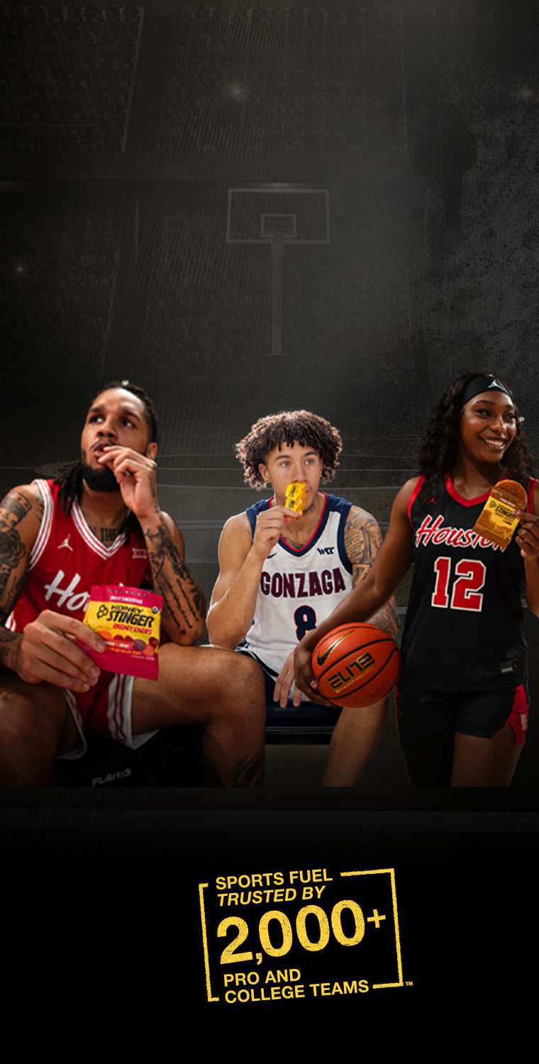 Three basketball players holding Honey Stinger sports fuel and a basketball on a dark background with 'Sports Fuel' branding.