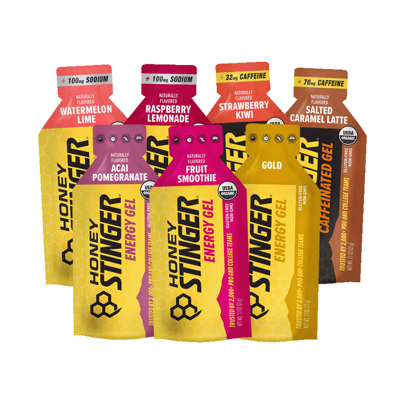 Honey Stinger energy gel packets in various flavors on a white background
