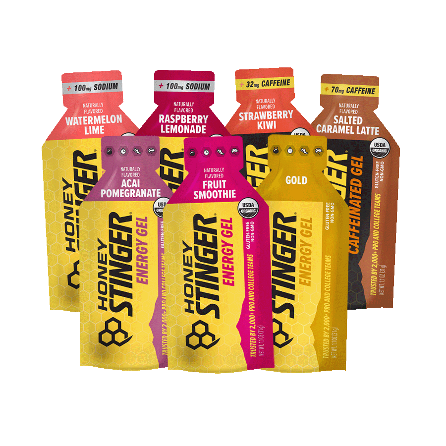 Honey Stinger energy gel packets in various flavors on a white background